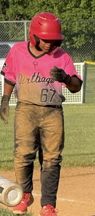 Player on the basepath with a uniform covered in infield dirt