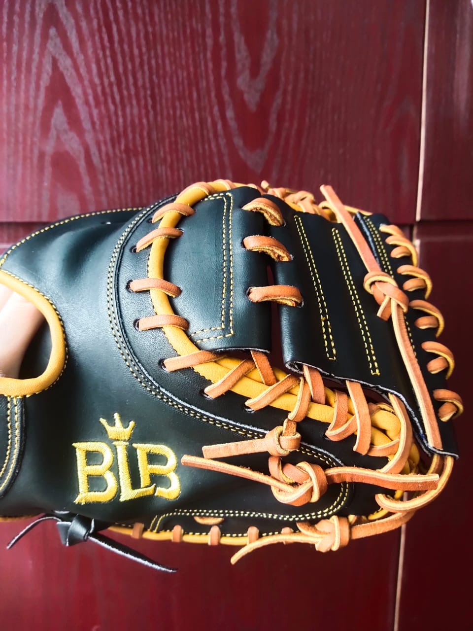 Close view of lacing and web on a Bush League Kip catcher's mitt