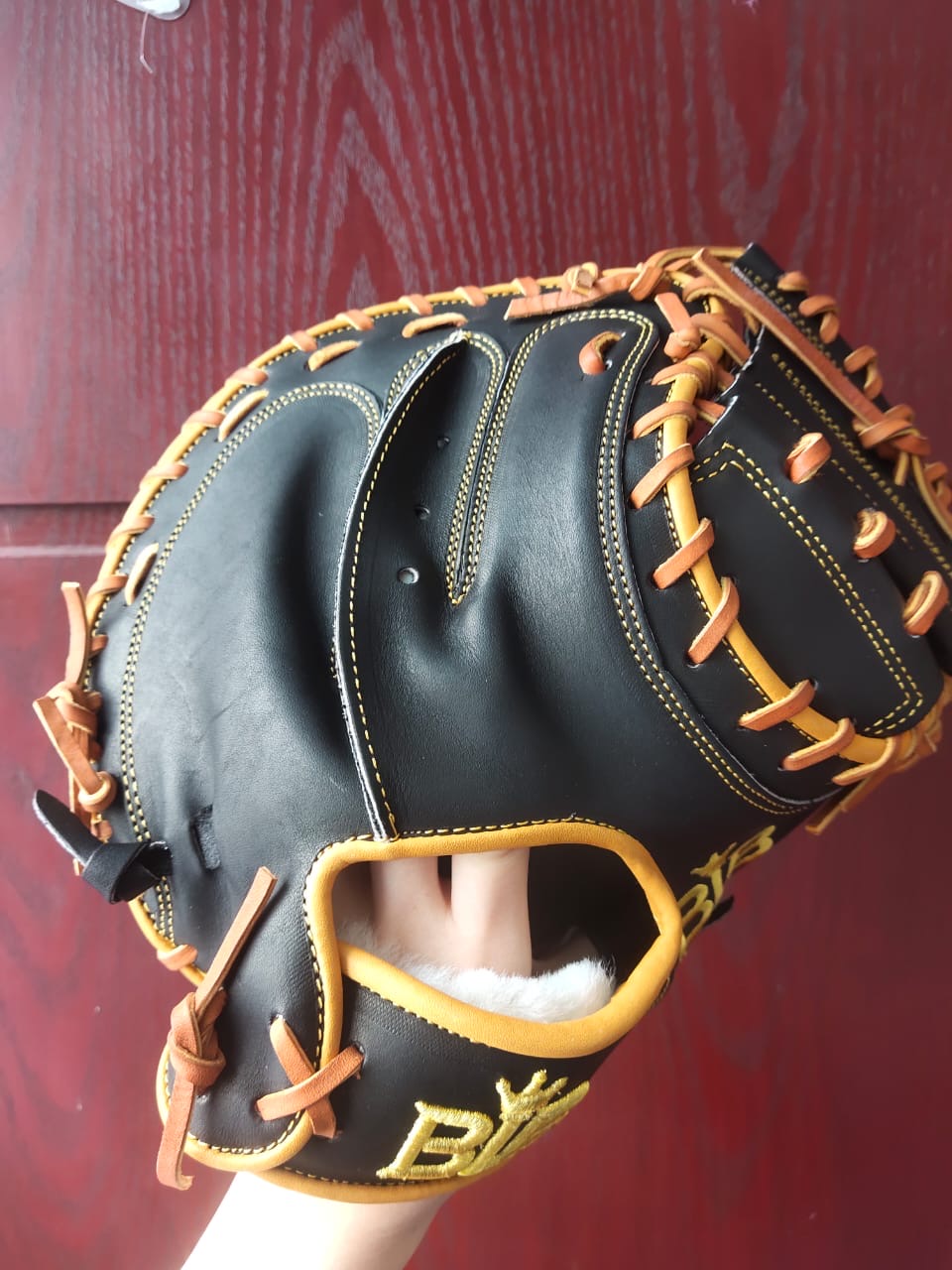 Back of a Bush League Kip catcher's mitt showing finger stalls