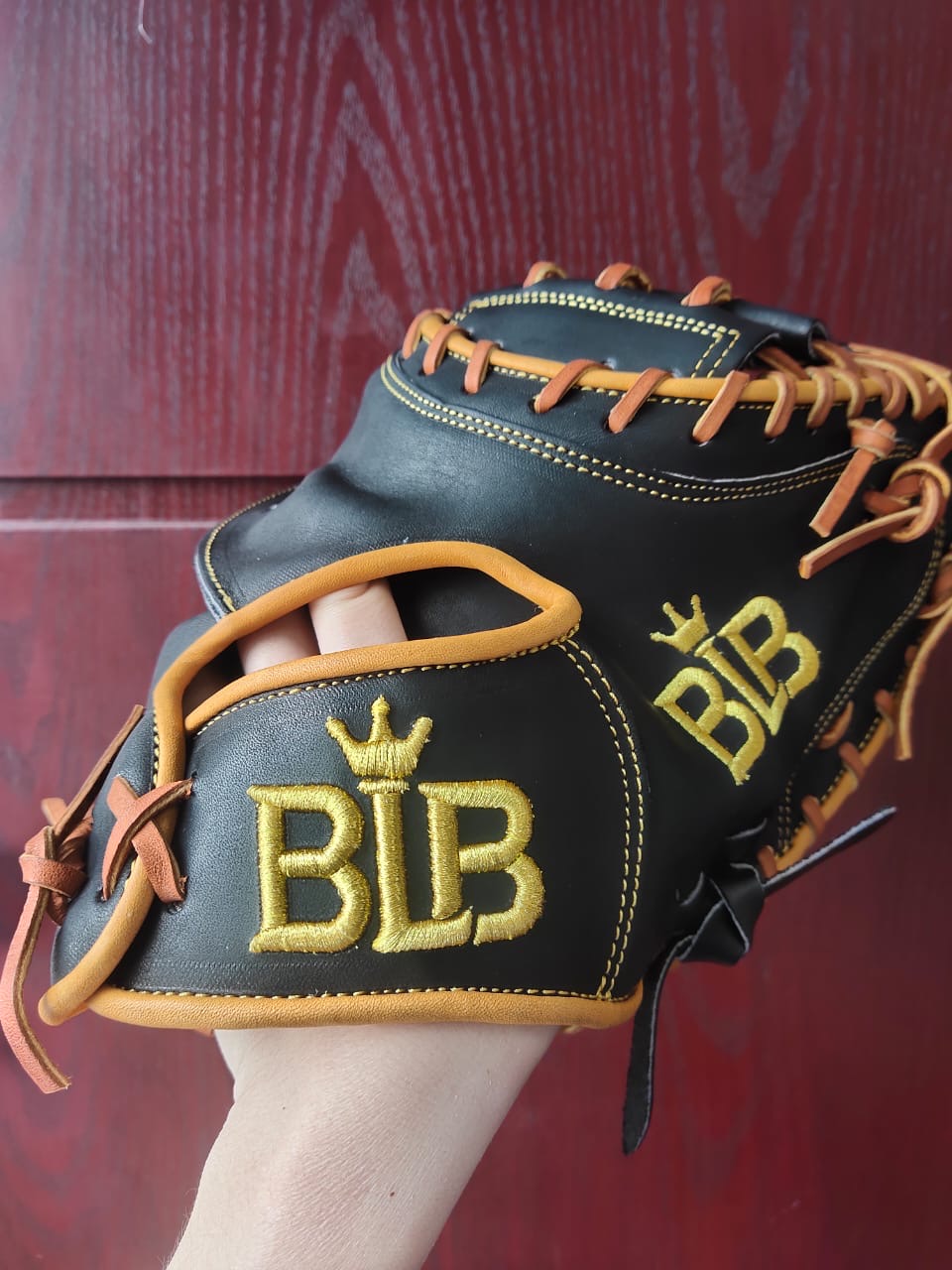 Black and tan Bush League Kip catcher's mitt with gold BLB embroidery